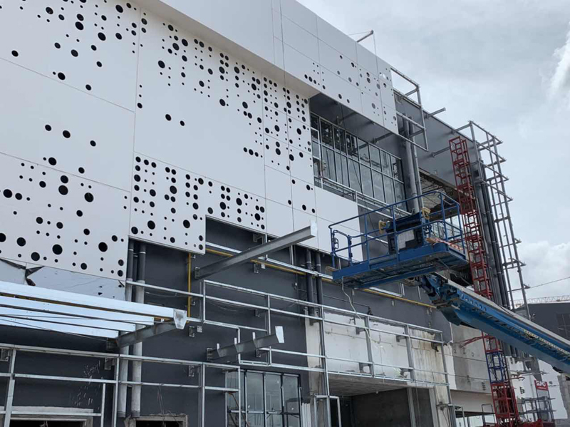 Installation of white aluminum wall panels